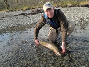 Grant Blinn with a shore caught steelhead about to be released