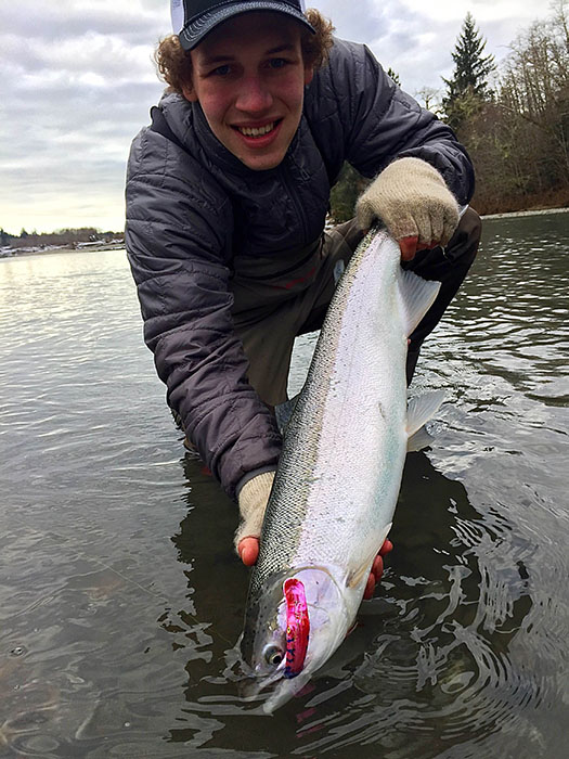 Aiden Liske with a plug caught winter steelhead, Photo by Eli Liske