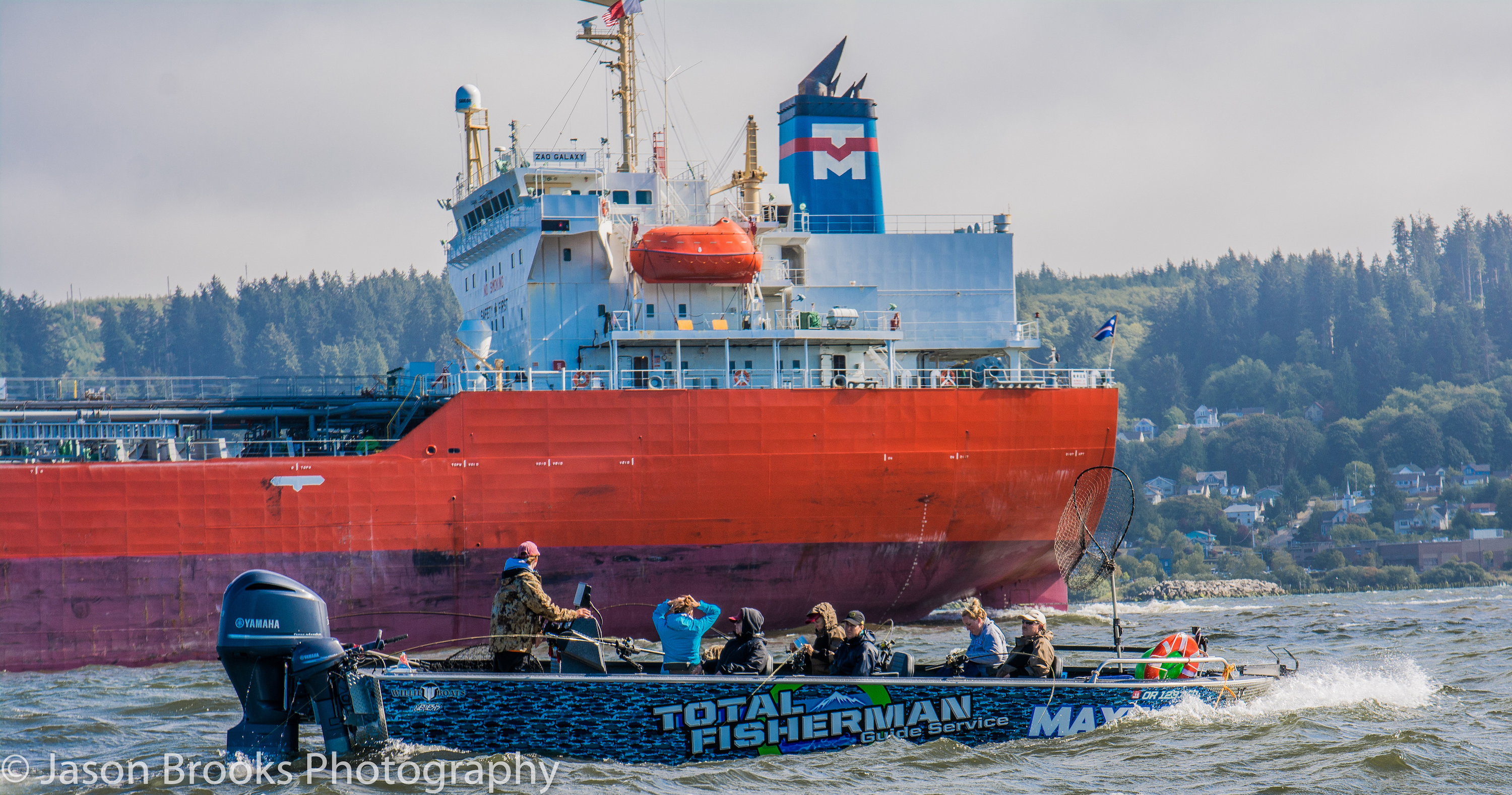 Waves and wind kicked up with the tide change while passing cargo ships