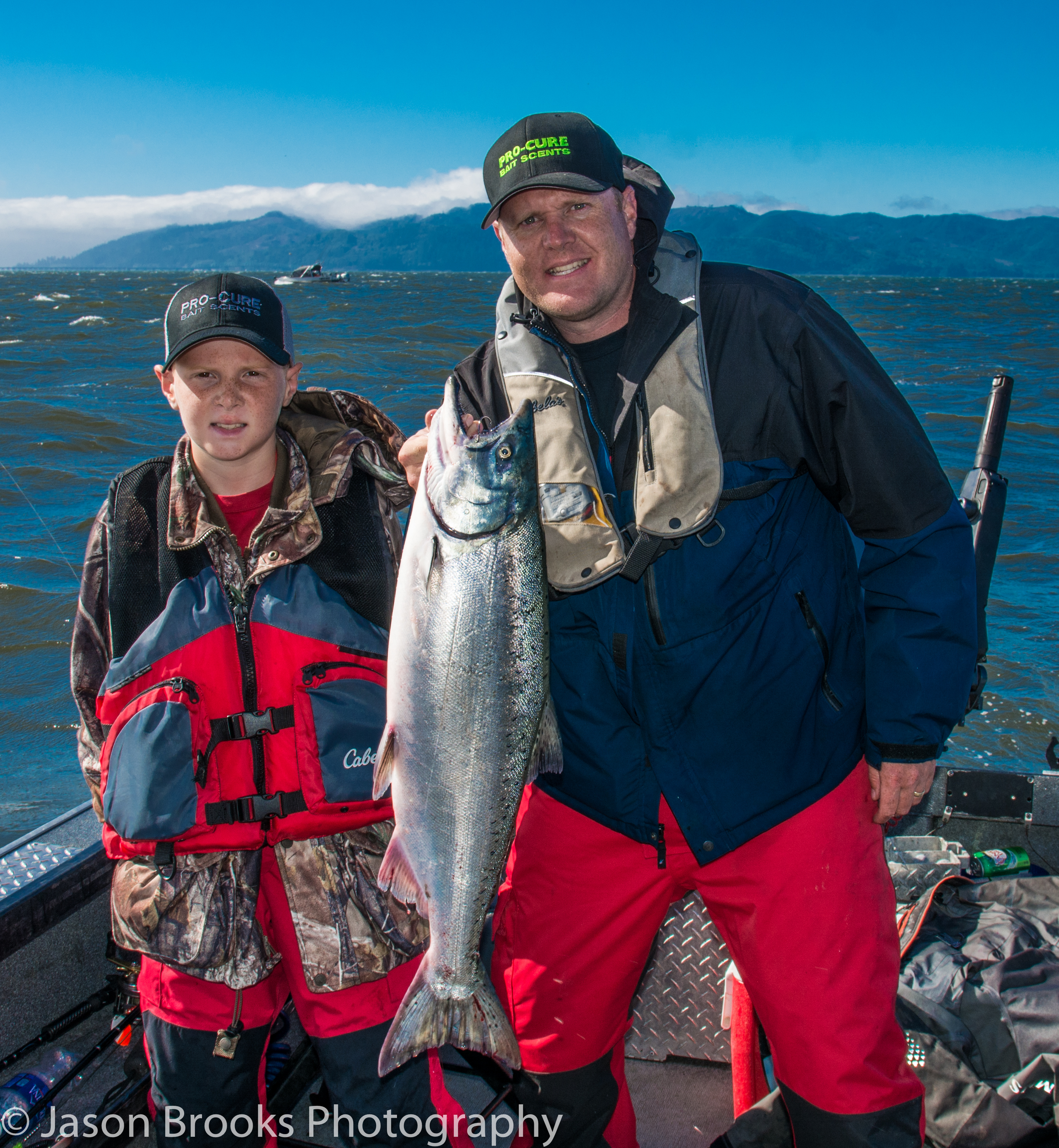 The author and his son with a Buoy 10 Chinook of his own