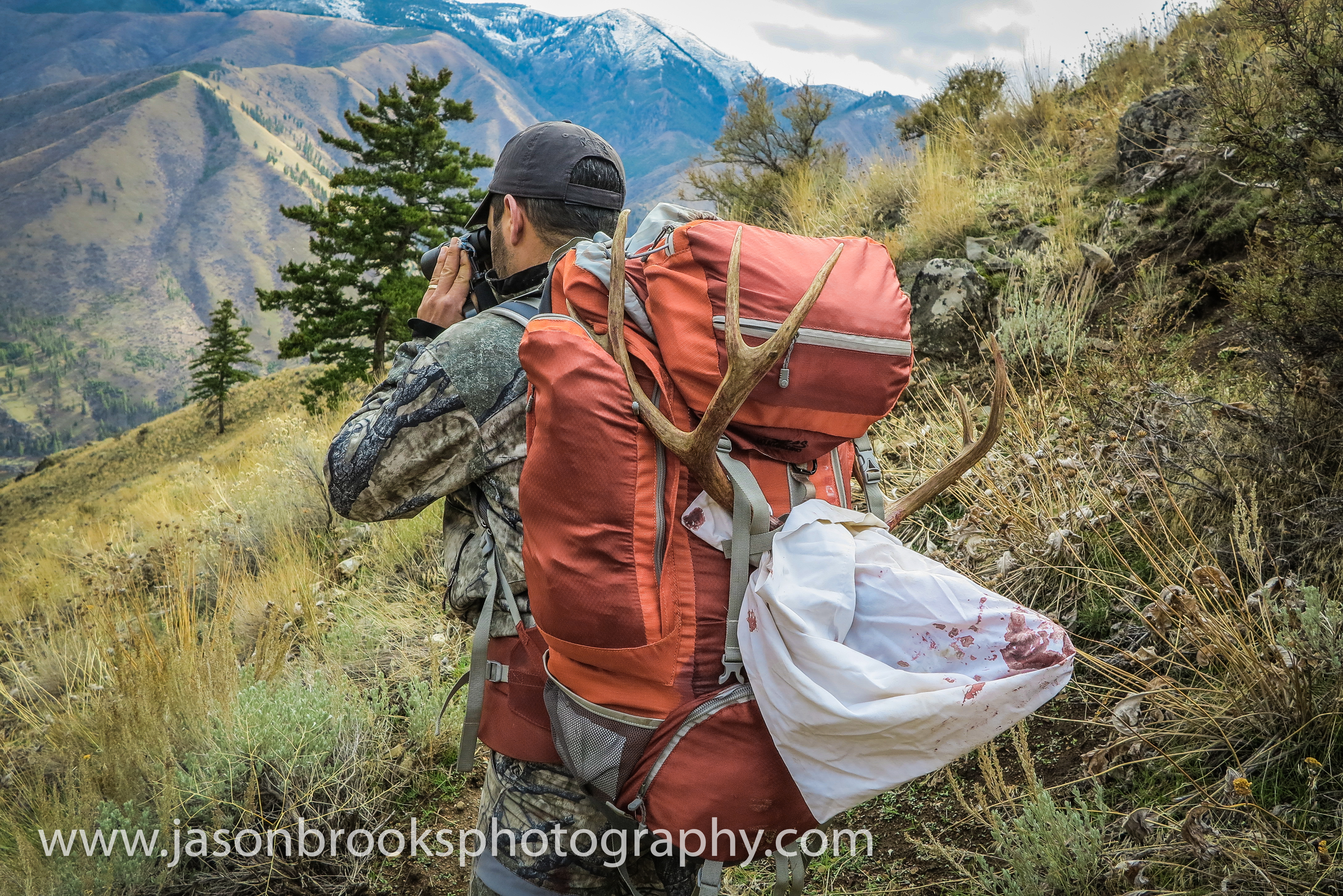 Chad Hurst packing out an Idaho buck he killed 5 miles from camp-Jason Brooks